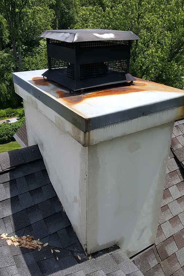 Before stucco and chase cover repair rusty around cap