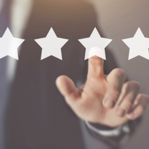 white stars with a hand coming up to choose one of the stars for a rating